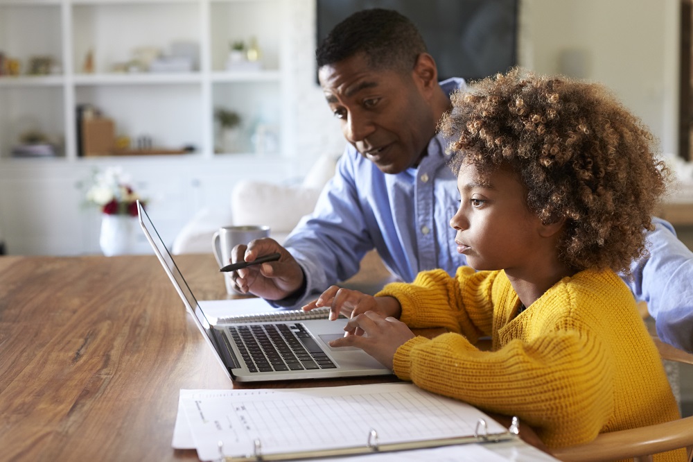 Father helping child with homework